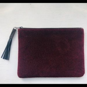Faux fur clutch bag.